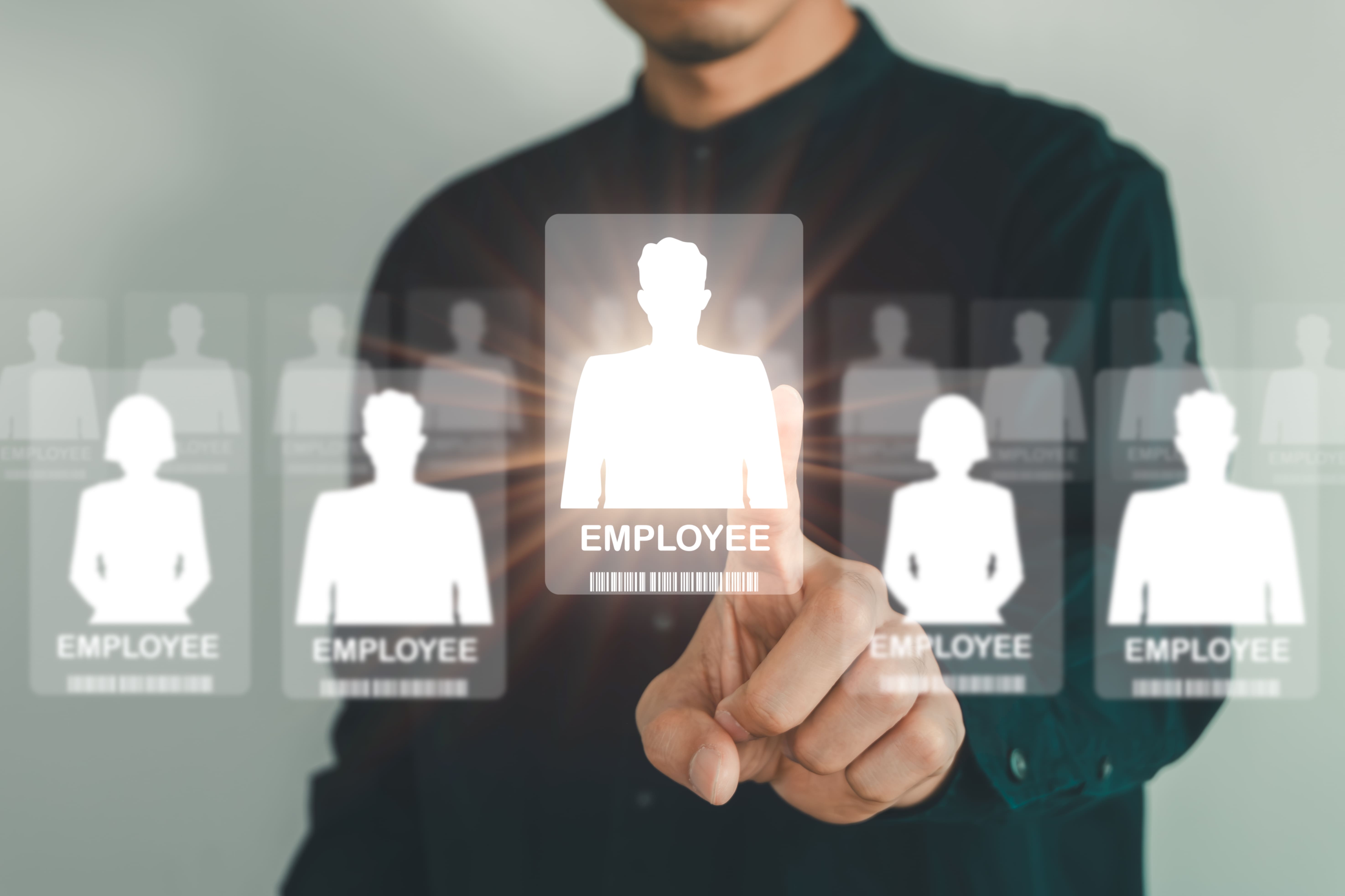 Businessman selecting digital employee profile — custom software solution for automating 				SME employee onboarding workflows.