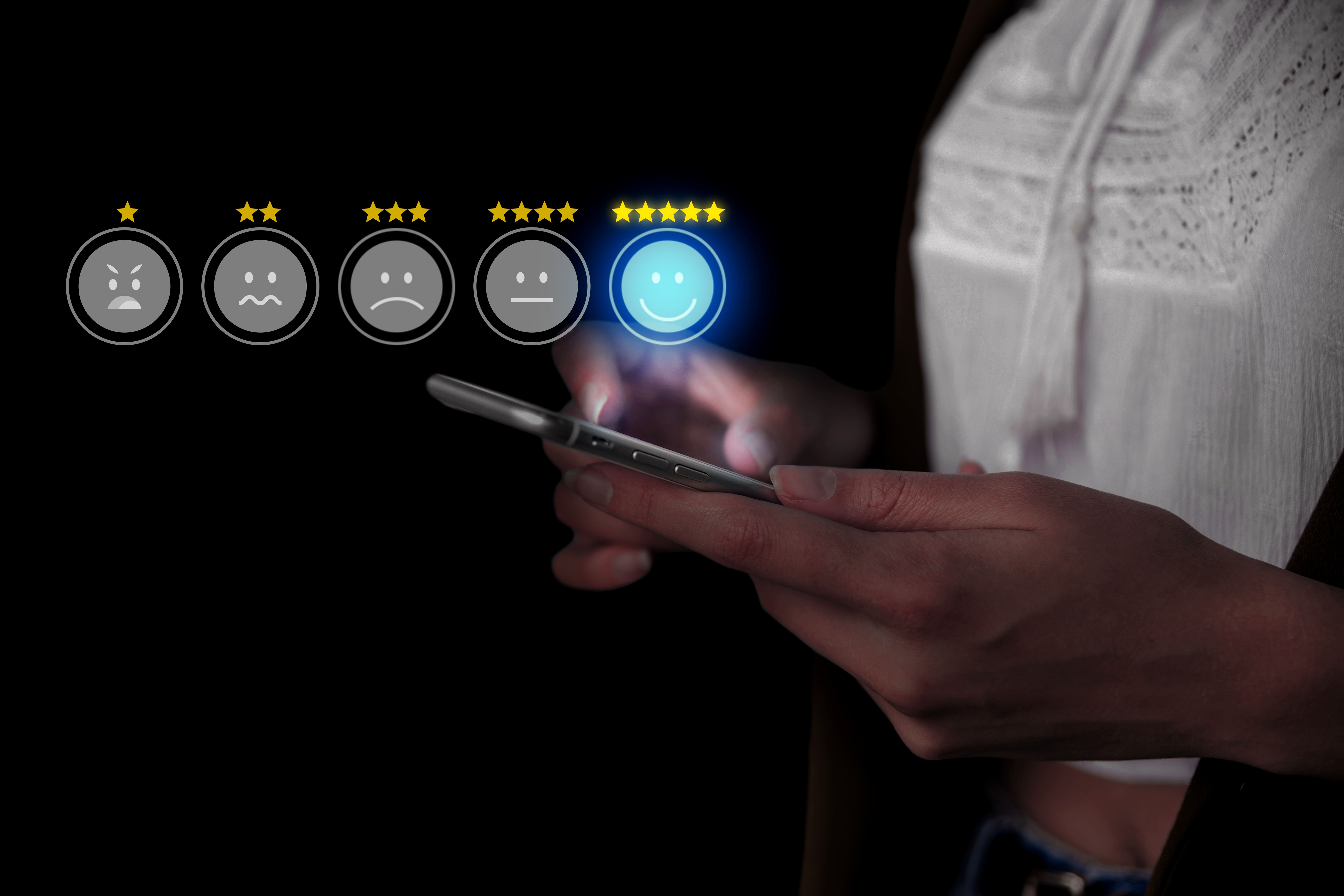 Person giving 5-star rating via mobile — custom-built performance review solution to 				simplify SME team evaluations.